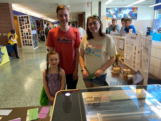 Alexandria Snavely, a kindergarten student, stopped by the lasercut bookmark station supervised by Hayden Anderson, an 11th-grader, and Emilia Stouffer, a 12th-grader, at the Greencastle-Antrim School District’s Art & STEAM Expo on Wednesday, May 1.